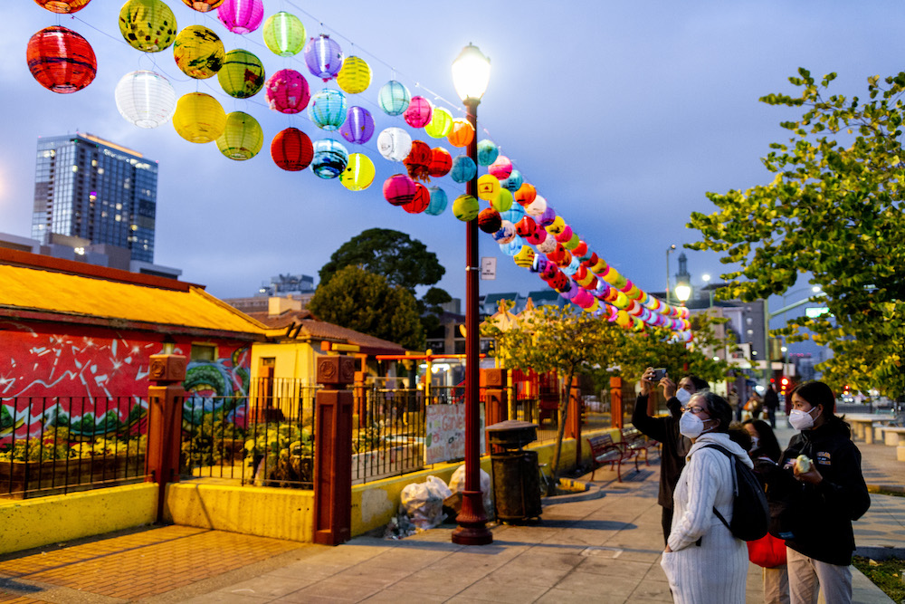 Passersby in Oakland Chinatown. Photo by Jonathan Fong.
