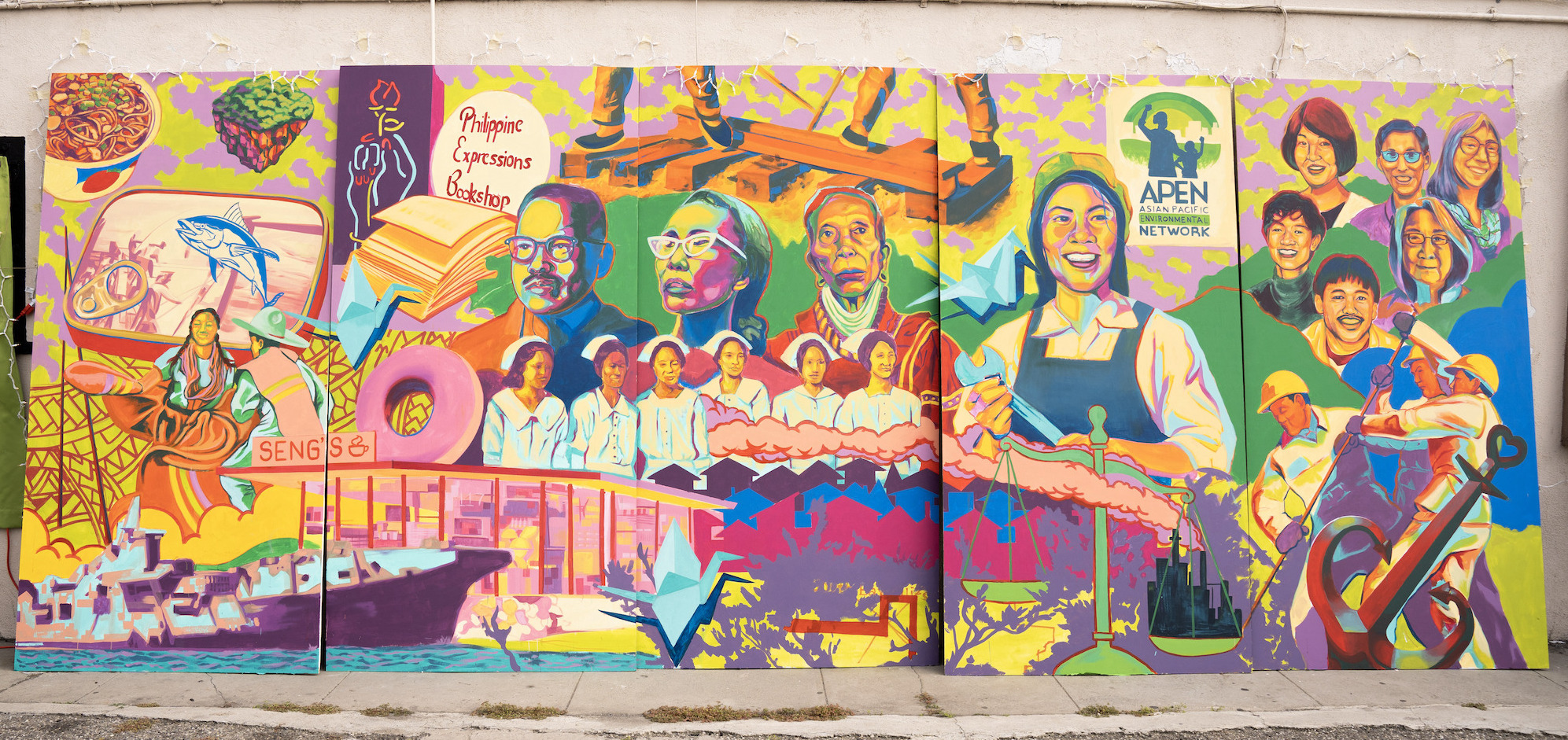 A mural outside the APEN Los Angeles office featuring depictions of AAPI movement leaders and symbols.
